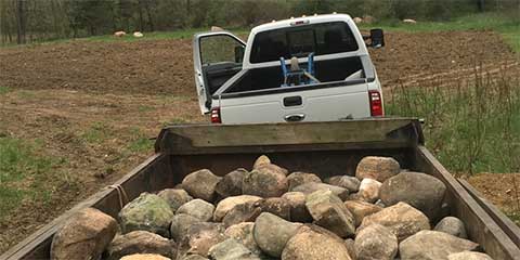 truck and trailer with rocks